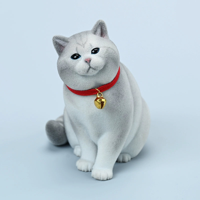 A set of four 1/6 scale British Short-haired Cat models in various fur colors, sitting on a wooden bench. Each cat wears a red collar with a small golden bell, capturing their lifelike and charming expressions. Perfect for collectors and cat enthusiasts.