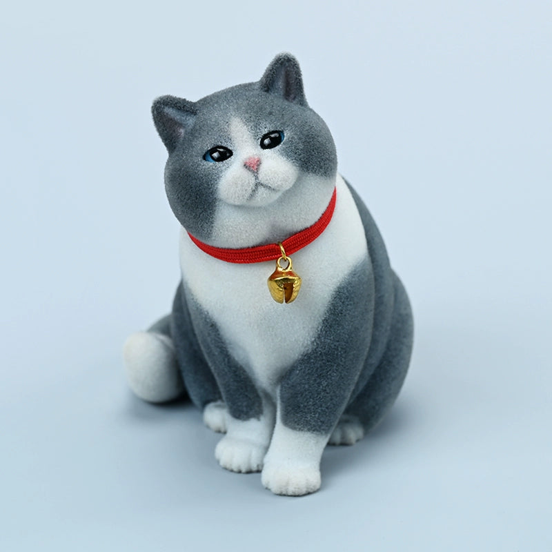 A set of four 1/6 scale British Short-haired Cat models in various fur colors, sitting on a wooden bench. Each cat wears a red collar with a small golden bell, capturing their lifelike and charming expressions. Perfect for collectors and cat enthusiasts.