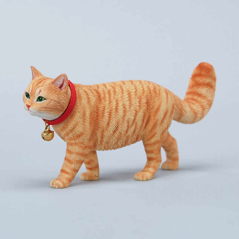 A beautifully crafted 1/6 scale model of a Chinese Felis Catus Cat, showcasing intricate details and a lifelike appearance. The cat model is posed elegantly, wearing a red collar with a bell, exuding charm and character. This figurine is perfect for cat enthusiasts and collectors, adding a touch of elegance and realism to any collection.