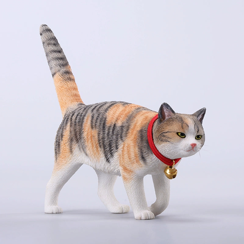 A detailed figurine of an orange tabby cat with a red collar and bell, part of the 1/6 Chinese Felis Catus Cat Model 7.0 series. The cat stands with an alert expression, showcasing lifelike details from its expressive eyes to the intricate fur texture.