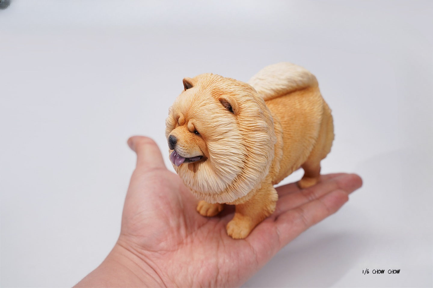 A set of four 1/6 scale Chow Chow resin models in different fur colors, showcasing the breed's distinctive fluffy appearance and detailed craftsmanship.