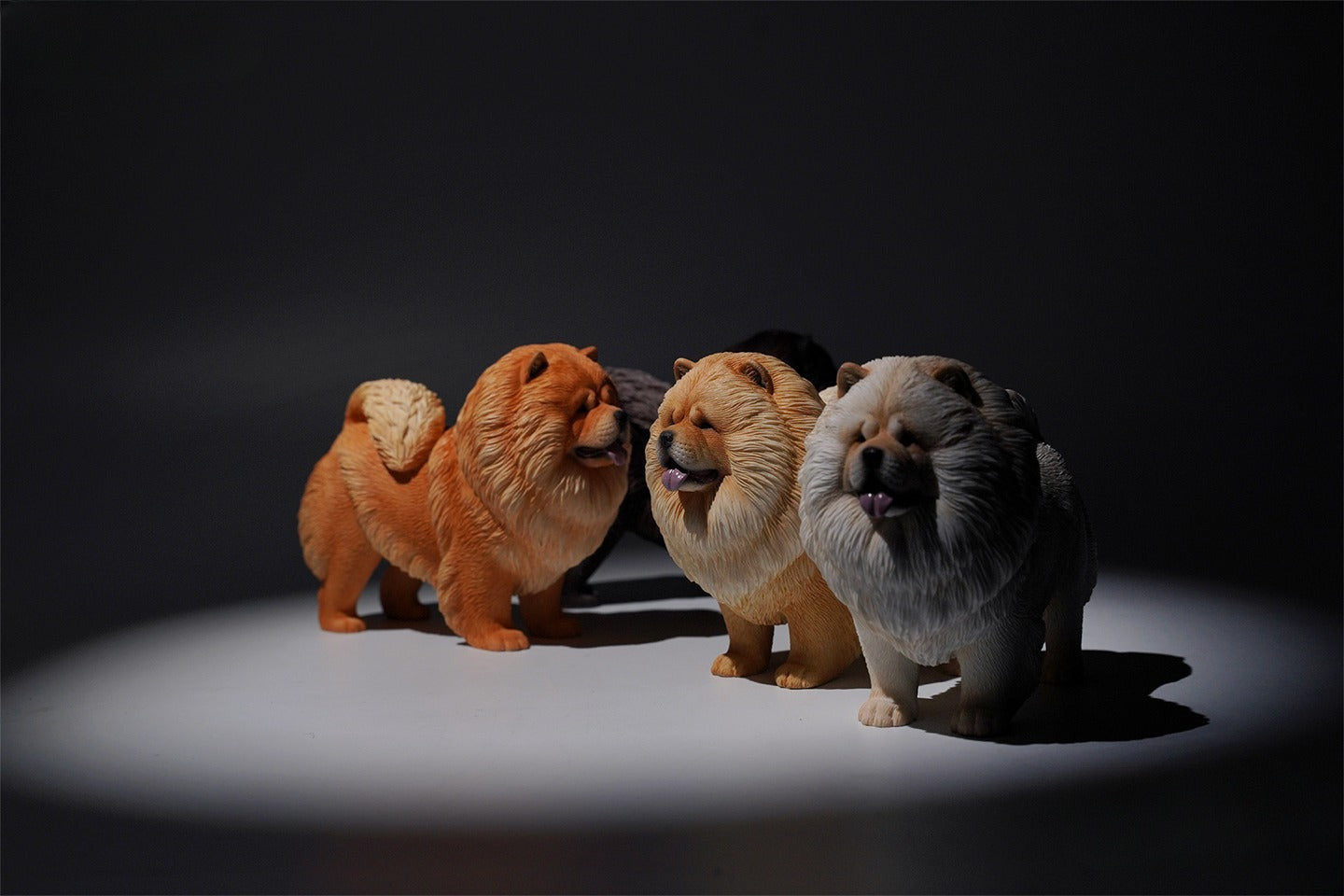 A set of four 1/6 scale Chow Chow resin models in different fur colors, showcasing the breed's distinctive fluffy appearance and detailed craftsmanship.