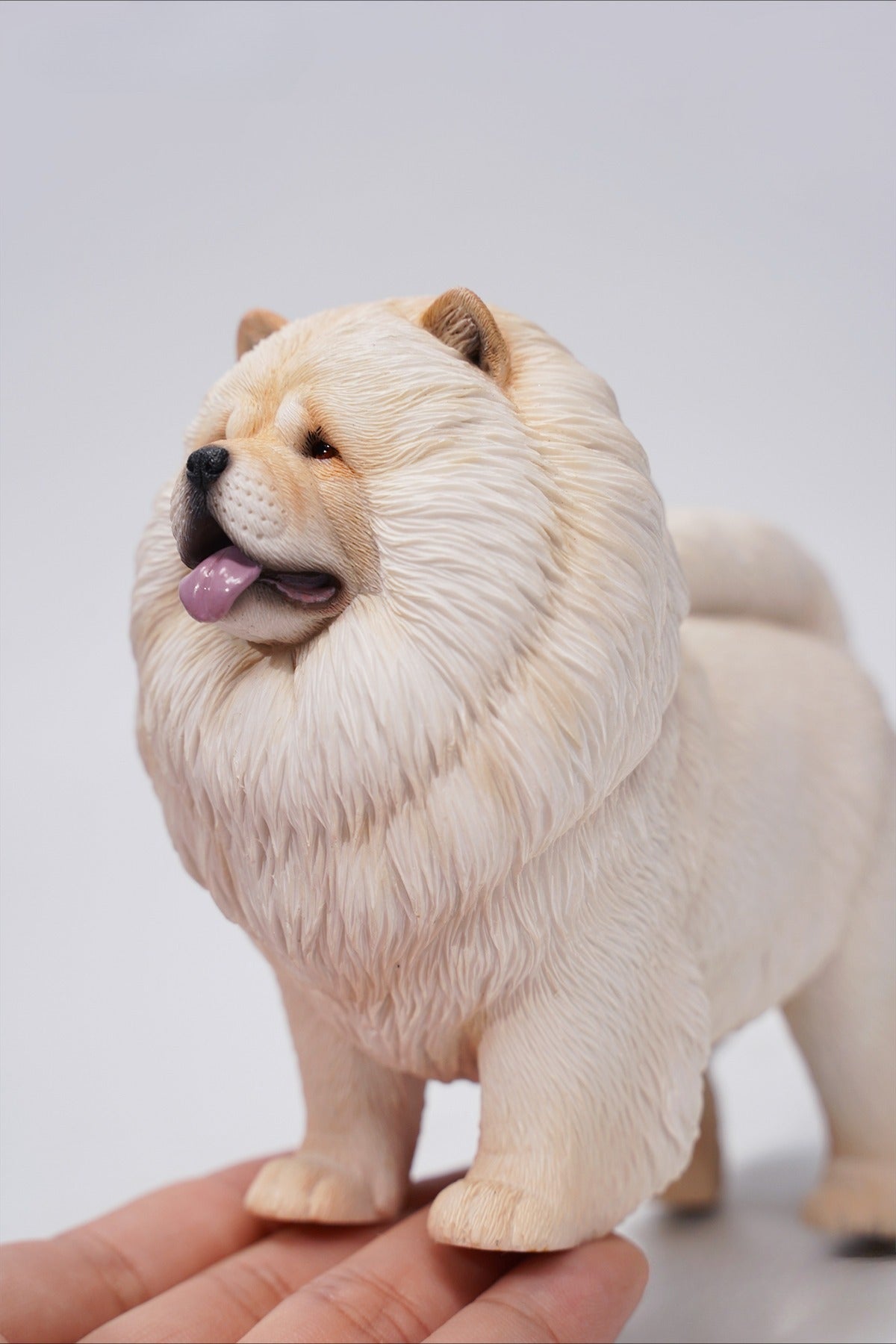 A set of four 1/6 scale Chow Chow resin models in different fur colors, showcasing the breed's distinctive fluffy appearance and detailed craftsmanship.