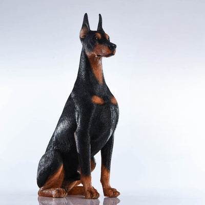 "A set of two 1/6 scale Doberman Pinscher resin models, one sitting and the other lying down, showcasing realistic details and noble posture."
