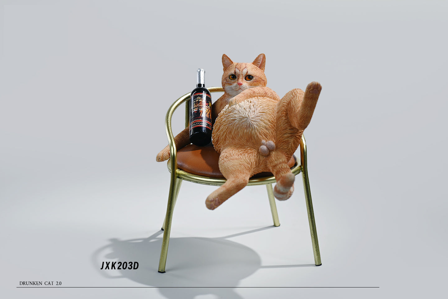 "A 1/6 scale figurine of an orange tabby cat lounging on a chair with a bottle, portraying a humorous 'drunk' pose."