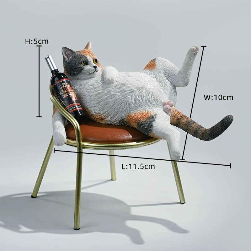 A 1/6 scale figurine of an orange tabby cat lounging on a chair with a bottle, portraying a humorous 'drunk' pose.