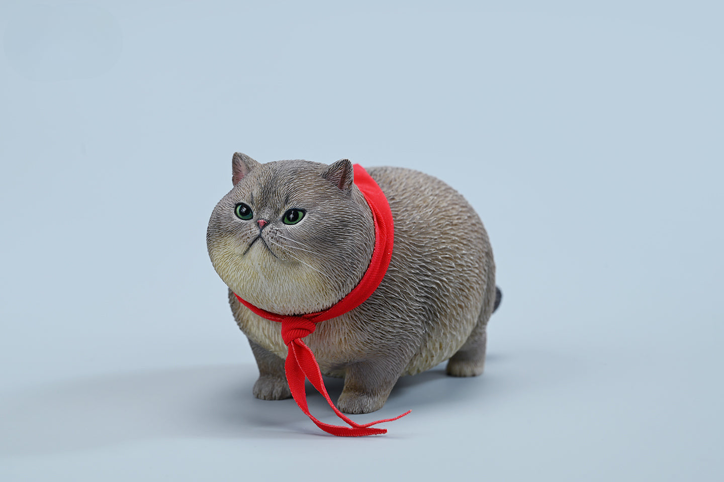  A collection of 1/6 Fat Cat 5.0 Models featuring four charming cat figurines in different colors, each adorned with a red scarf. The figurines showcase detailed expressions and fur textures, perfect for cat lovers and collectors.