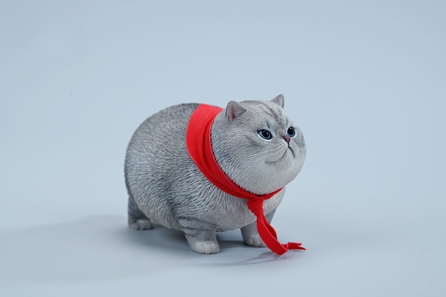  A collection of 1/6 Fat Cat 5.0 Models featuring four charming cat figurines in different colors, each adorned with a red scarf. The figurines showcase detailed expressions and fur textures, perfect for cat lovers and collectors.