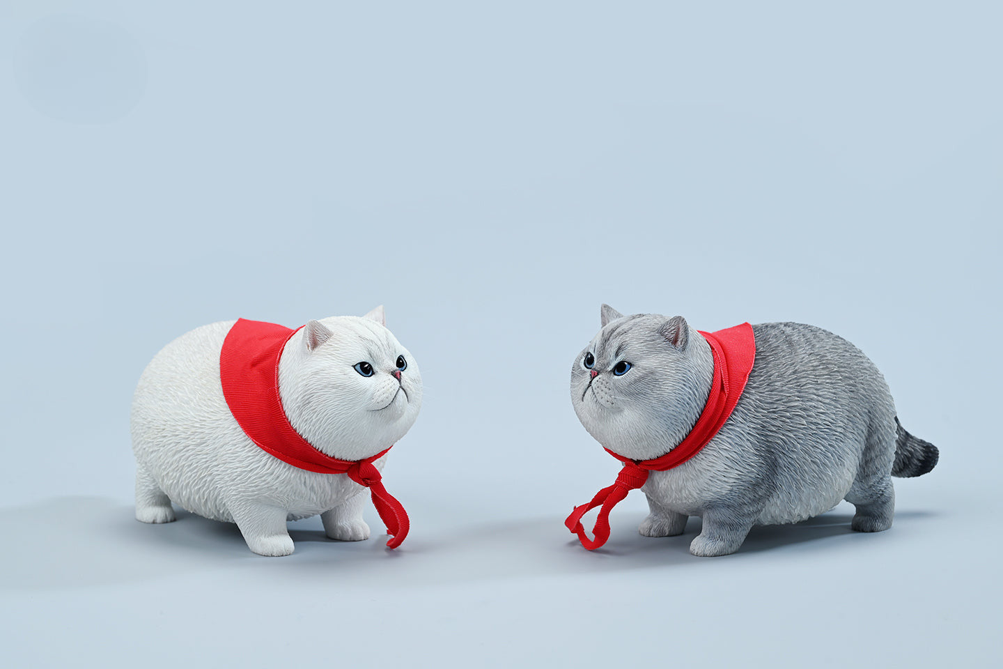  A collection of 1/6 Fat Cat 5.0 Models featuring four charming cat figurines in different colors, each adorned with a red scarf. The figurines showcase detailed expressions and fur textures, perfect for cat lovers and collectors.