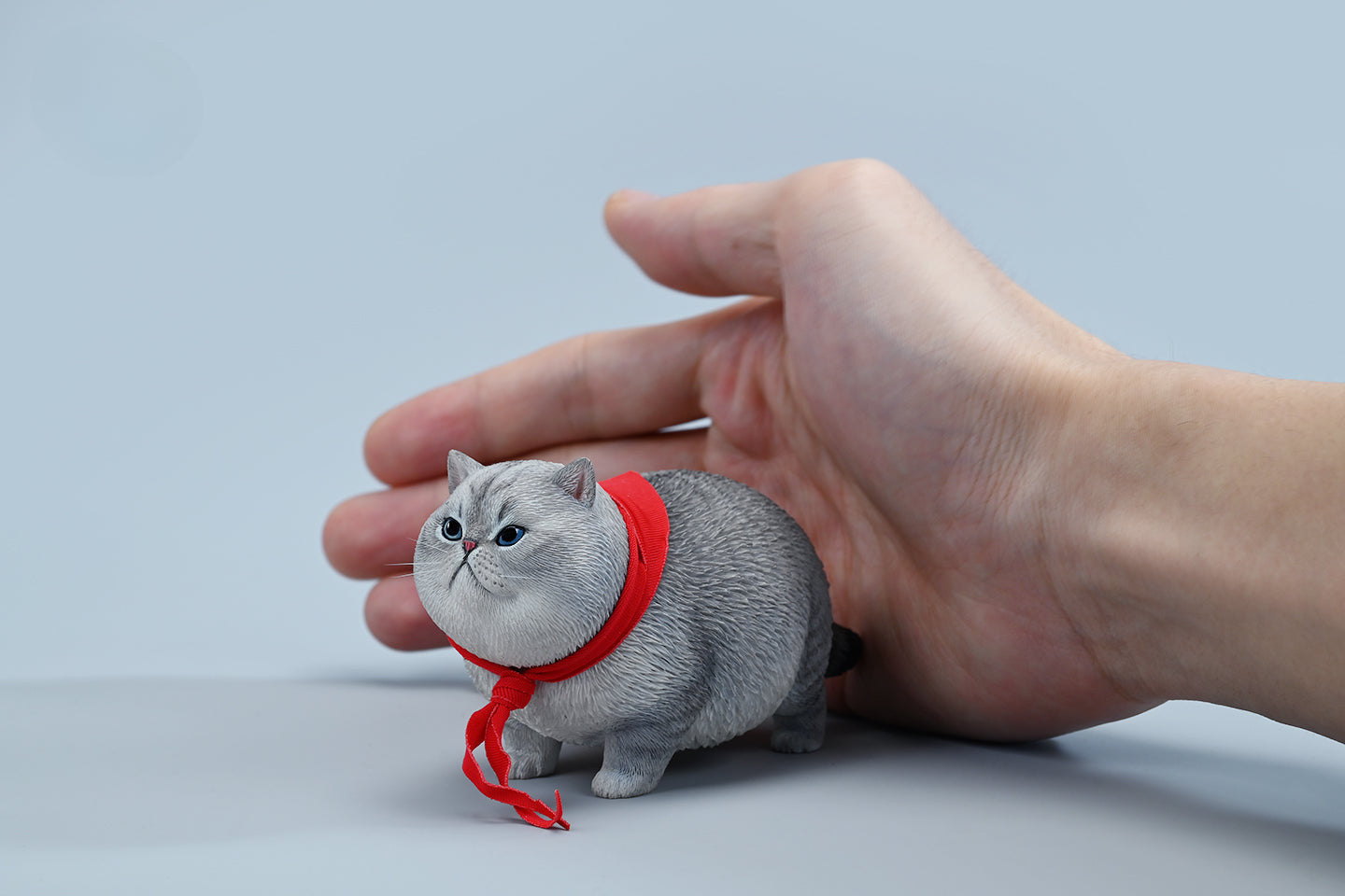  A collection of 1/6 Fat Cat 5.0 Models featuring four charming cat figurines in different colors, each adorned with a red scarf. The figurines showcase detailed expressions and fur textures, perfect for cat lovers and collectors.