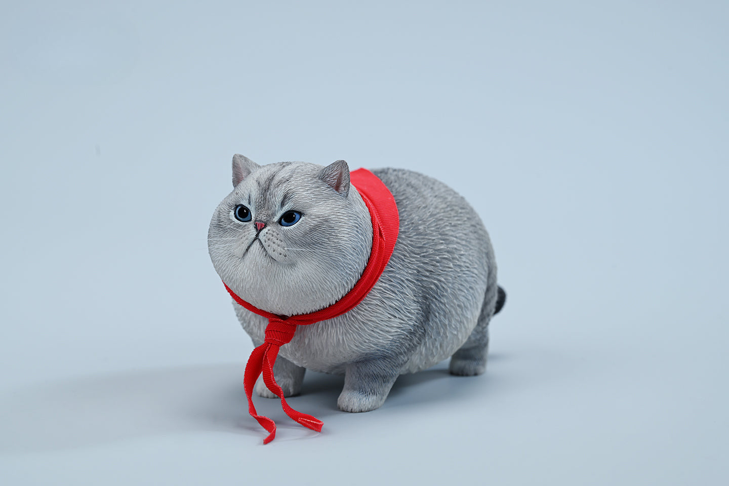  A collection of 1/6 Fat Cat 5.0 Models featuring four charming cat figurines in different colors, each adorned with a red scarf. The figurines showcase detailed expressions and fur textures, perfect for cat lovers and collectors.