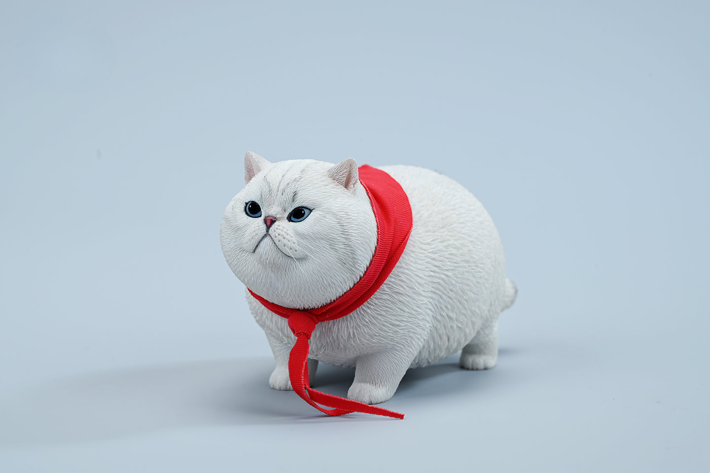  A collection of 1/6 Fat Cat 5.0 Models featuring four charming cat figurines in different colors, each adorned with a red scarf. The figurines showcase detailed expressions and fur textures, perfect for cat lovers and collectors.