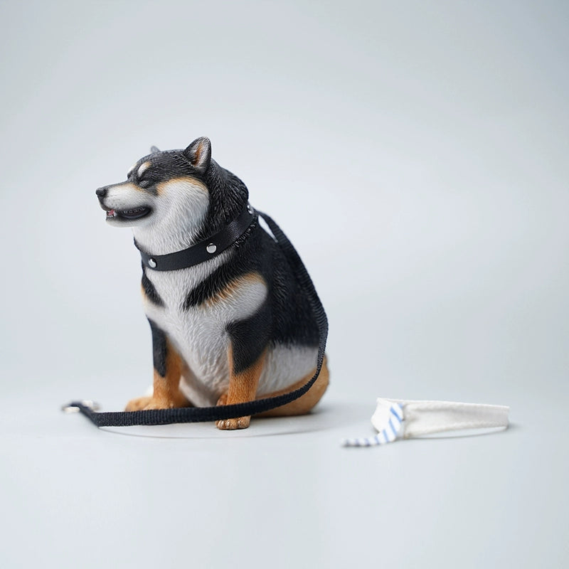 Three 1/6 scale Fat Shiba Lun Dog Models, each wearing a blue and white striped tie, sitting in a row on a green surface with their reflections visible in the water below. These figurines feature realistic details and cheerful expressions, perfect for collectors and dog enthusiasts.