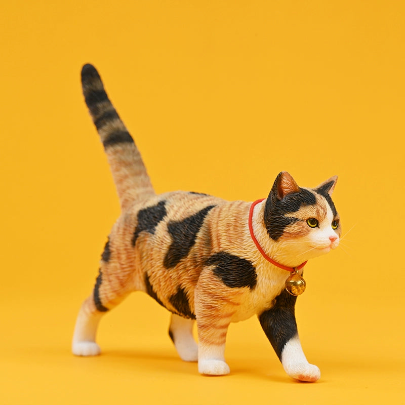 Four 1/6 scale Felis Catus 4.0 Model figurines, featuring detailed representations of different cat breeds with distinct coat colors, each wearing a red collar with a gold bell. The cats are positioned in a walking stance against a bright yellow background, showcasing their unique personalities and lifelike textures.