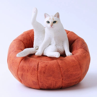 "Five detailed resin models of lazy cats are shown sitting with their legs raised, each in different poses and colors. The cats display unique and expressive features, capturing the essence of relaxation in feline form. The background is neutral, emphasizing the intricate design and texture of each figurine, making them a perfect addition to any cat lover's collection."