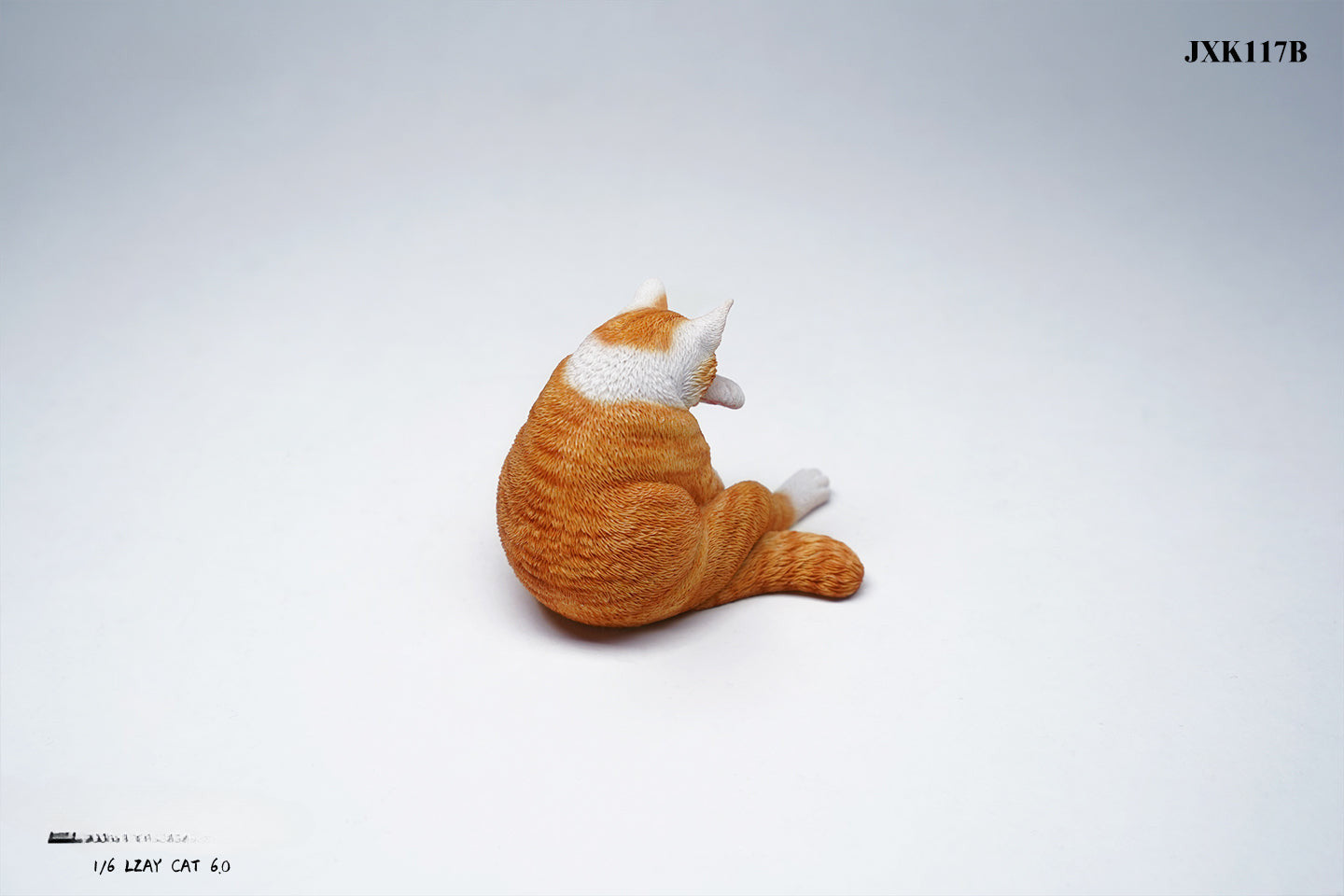 A 1/6 scale model of a lazy cat in various poses, including a ginger cat lounging on a blue bean bag. This highly detailed figurine captures the whimsical and relaxed nature of the cat, making it a perfect collectible for cat lovers and miniature enthusiasts.