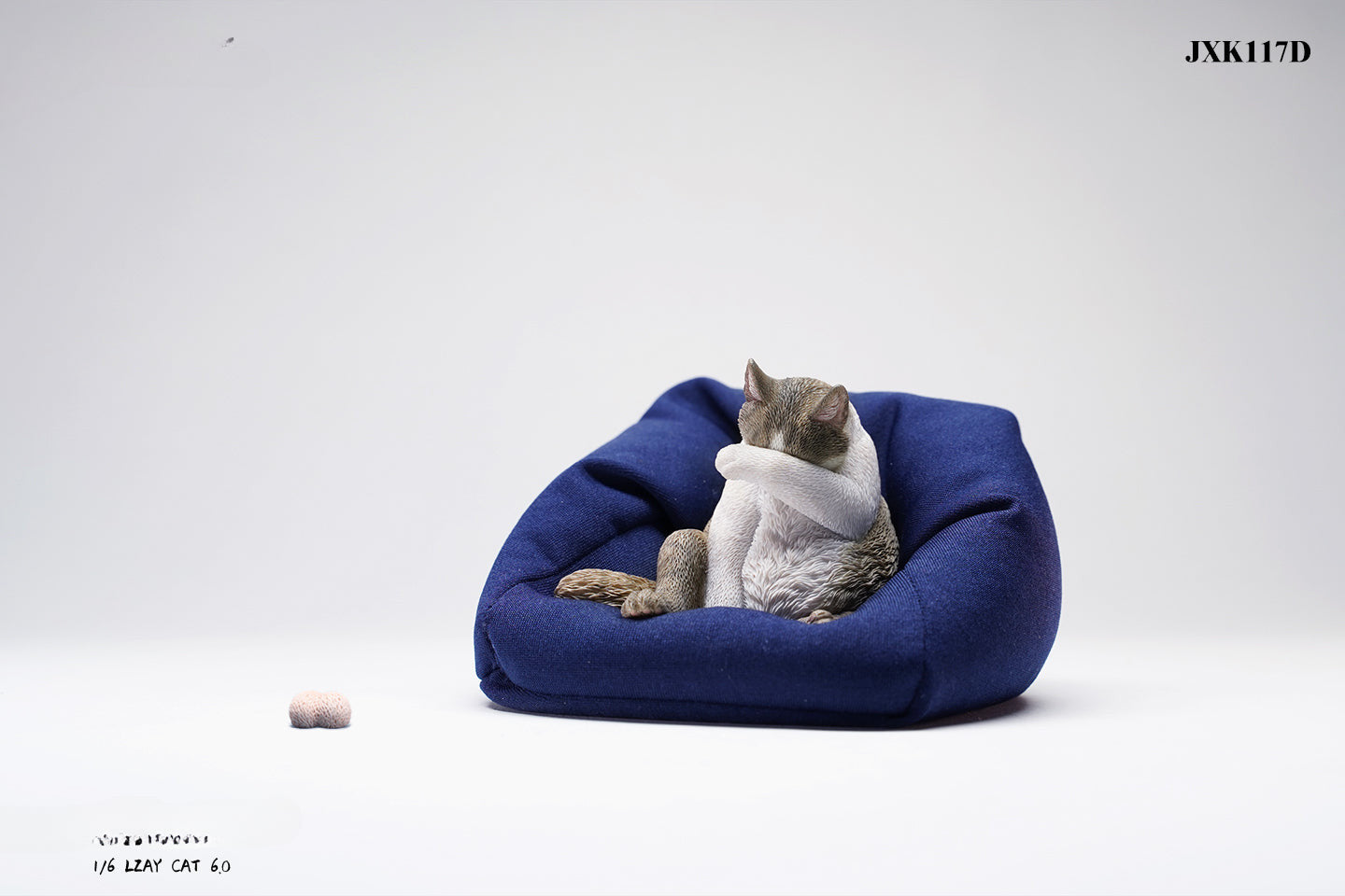 A 1/6 scale model of a lazy cat in various poses, including a ginger cat lounging on a blue bean bag. This highly detailed figurine captures the whimsical and relaxed nature of the cat, making it a perfect collectible for cat lovers and miniature enthusiasts.