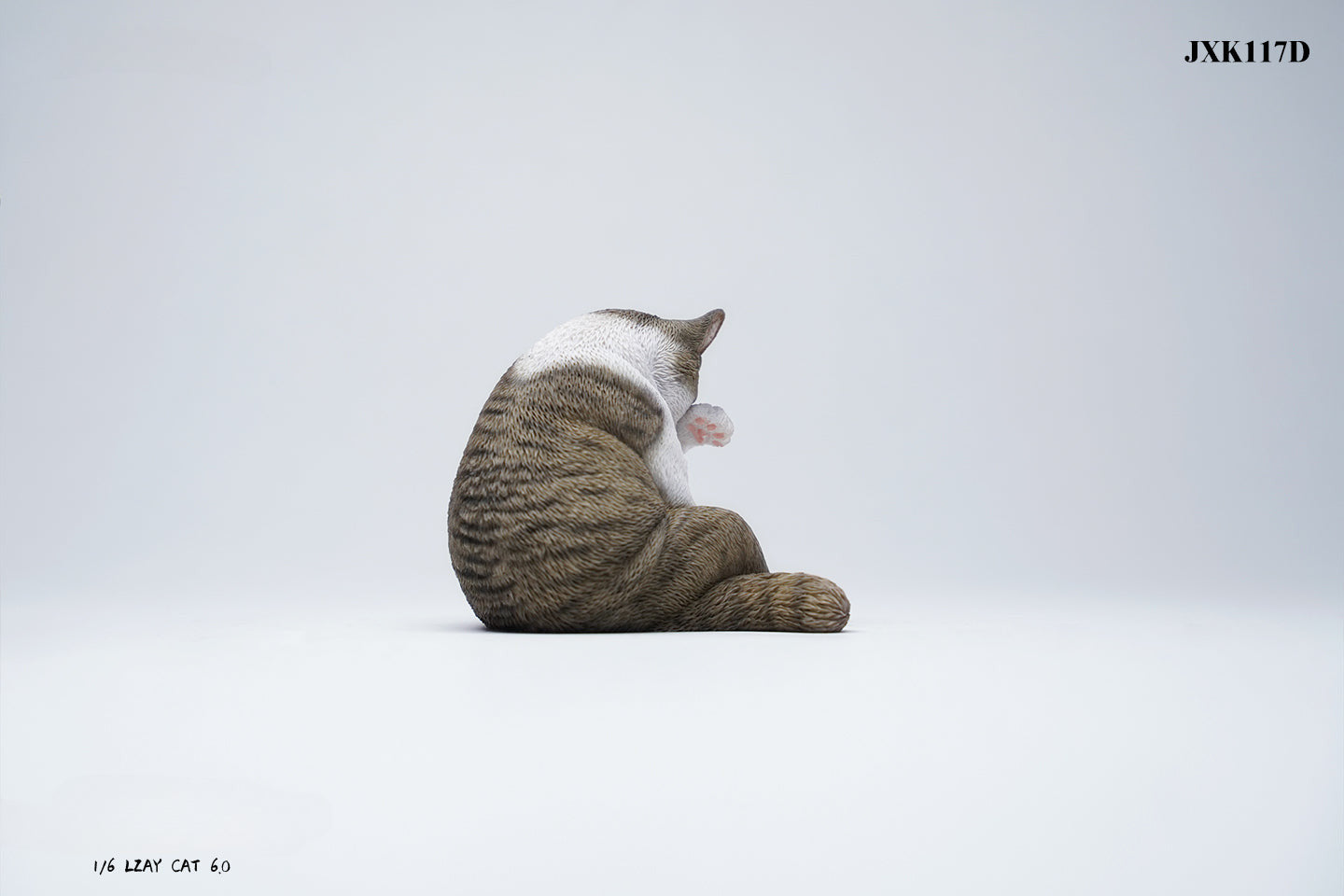 A 1/6 scale model of a lazy cat in various poses, including a ginger cat lounging on a blue bean bag. This highly detailed figurine captures the whimsical and relaxed nature of the cat, making it a perfect collectible for cat lovers and miniature enthusiasts.