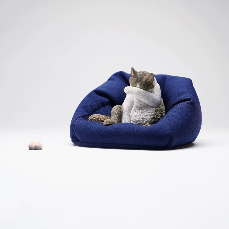  Image Rename: lazy-cat-6-model.jpg  Alt Text: A 1/6 scale model of a lazy cat in various poses, including a ginger cat lounging on a blue bean bag. This highly detailed figurine captures the whimsical and relaxed nature of the cat, making it a perfect collectible for cat lovers and miniature enthusiasts.