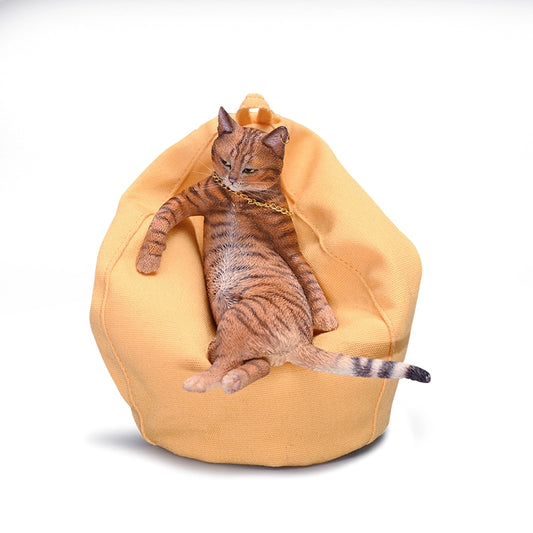 A 1/6 scale leopard cat model lounging on a yellow beanbag. The figurine captures the relaxed and lifelike features of a leopard cat wearing a gold chain, making it a charming decorative piece.