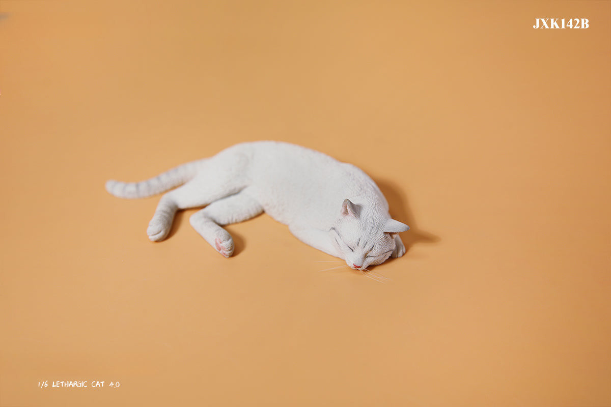 A realistic 1/6 scale model of a relaxed gray cat sleeping on a soft, gray couch, accompanied by two other cat figures lying nearby. The cat figures are detailed with life-like features, capturing their lazy and content postures, perfect for collectors and cat enthusiasts.