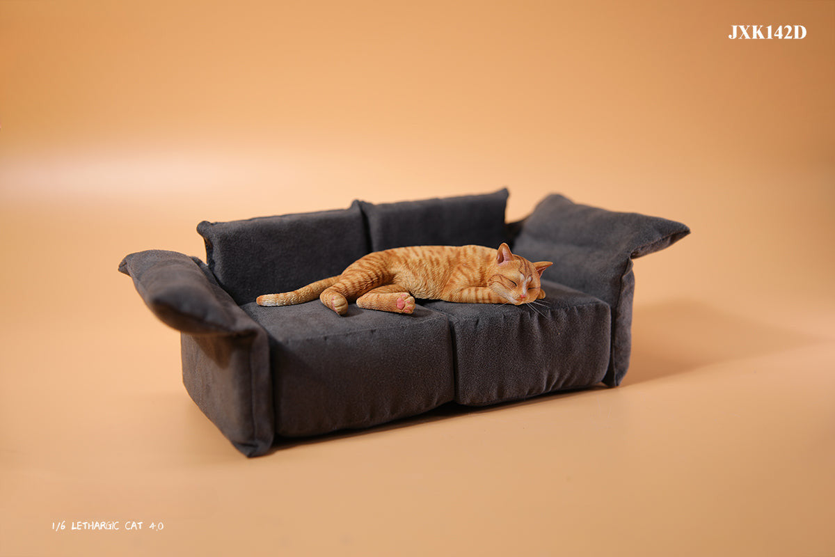 A realistic 1/6 scale model of a relaxed gray cat sleeping on a soft, gray couch, accompanied by two other cat figures lying nearby. The cat figures are detailed with life-like features, capturing their lazy and content postures, perfect for collectors and cat enthusiasts.