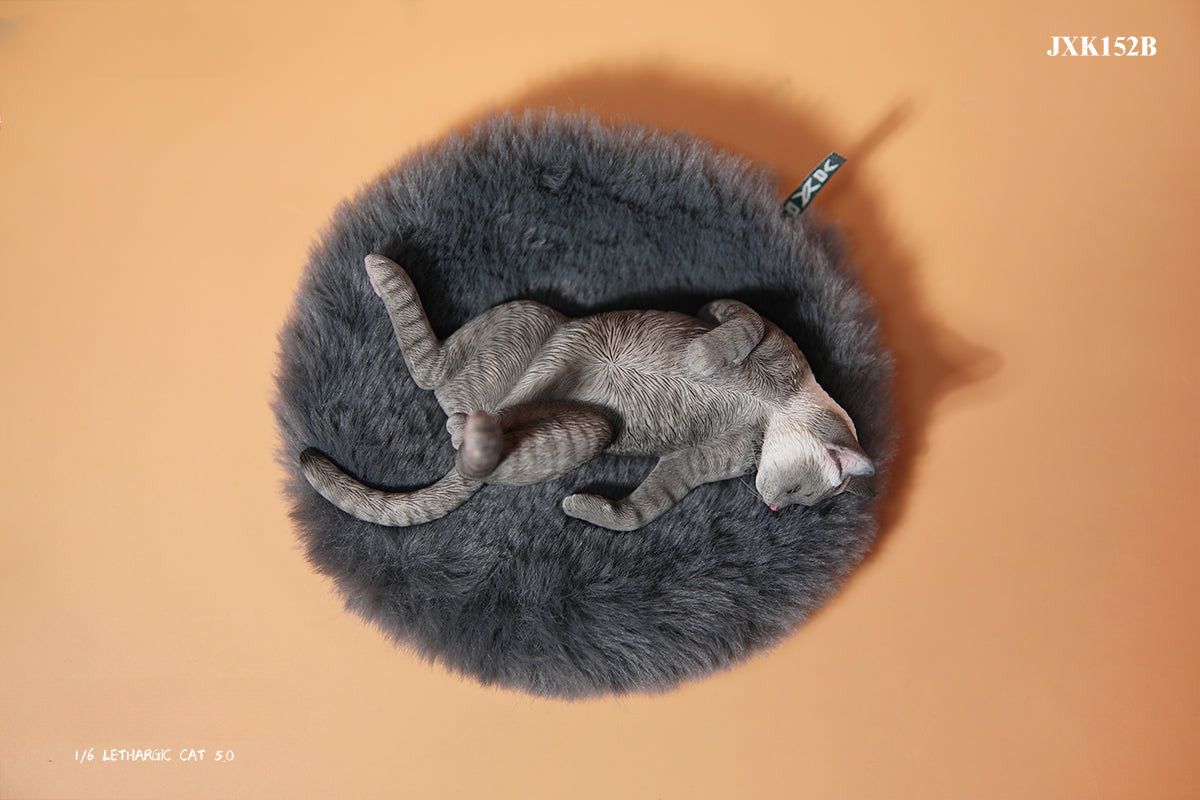 A set of 1/6 scale Lethargic Cat 5.0 models showing various cats in different relaxed, sleeping positions. Each cat is detailed with realistic fur textures and unique coat colors, resting on a grey cushion or a dark grey couch, perfectly capturing the essence of a lazy cat's nap.