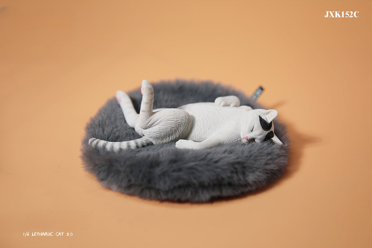 A set of 1/6 scale Lethargic Cat 5.0 models showing various cats in different relaxed, sleeping positions. Each cat is detailed with realistic fur textures and unique coat colors, resting on a grey cushion or a dark grey couch, perfectly capturing the essence of a lazy cat's nap.