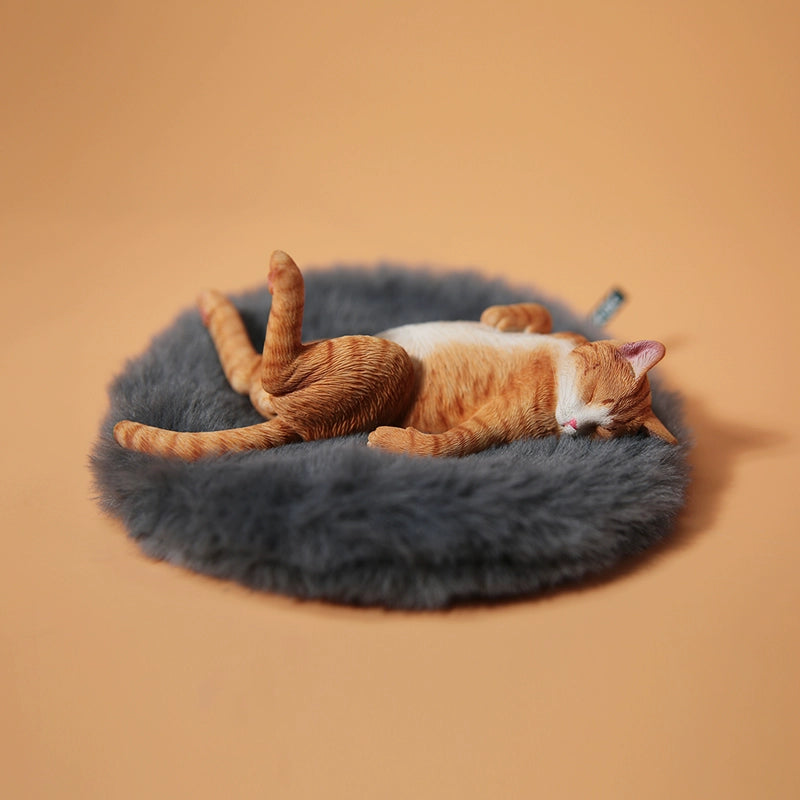 A set of 1/6 scale Lethargic Cat 5.0 models showing various cats in different relaxed, sleeping positions. Each cat is detailed with realistic fur textures and unique coat colors, resting on a grey cushion or a dark grey couch, perfectly capturing the essence of a lazy cat's nap.