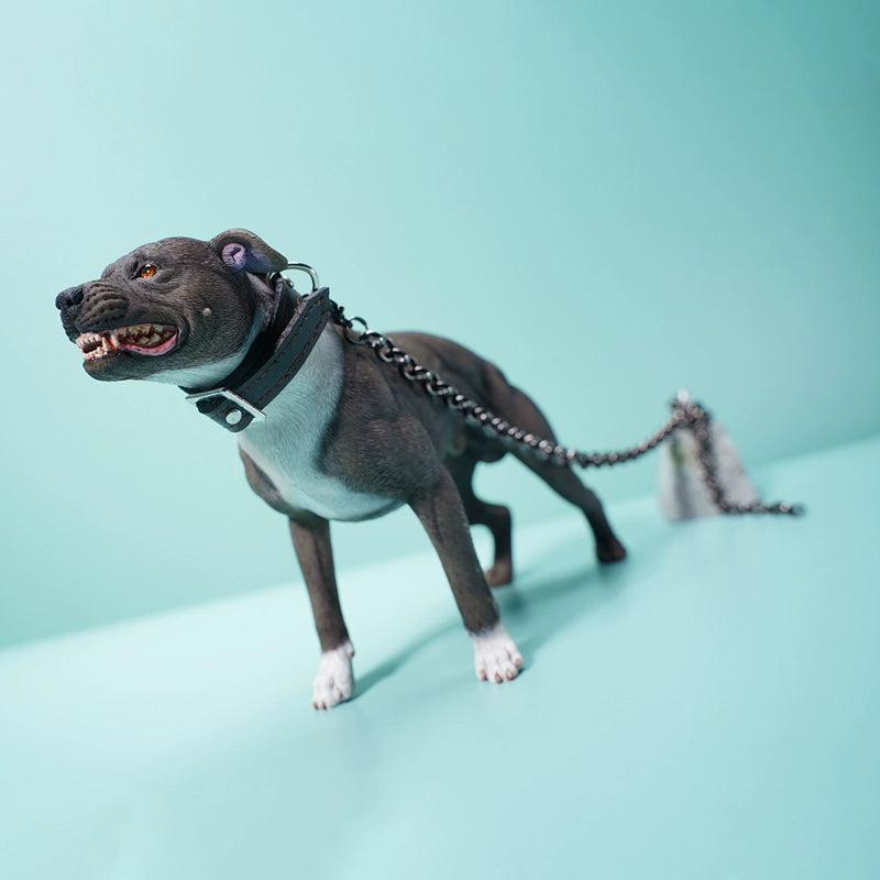 "1/6 scale Pit Bull simulation animal models displayed in various poses, including a chained brown Pit Bull with a menacing snarl. These realistic figurines feature detailed expressions and muscular builds, capturing the powerful and protective nature of the breed. A perfect addition to any collector's showcase."