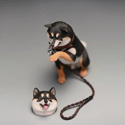 A set of six 1/6 scale Shiba Inu figurines, each striking a cute, playful pose. The dogs are seated with one paw raised, exuding a charming and friendly demeanor. They come in various coat colors, including white, black, and tan, and are depicted with lifelike detailing and cheerful expressions.