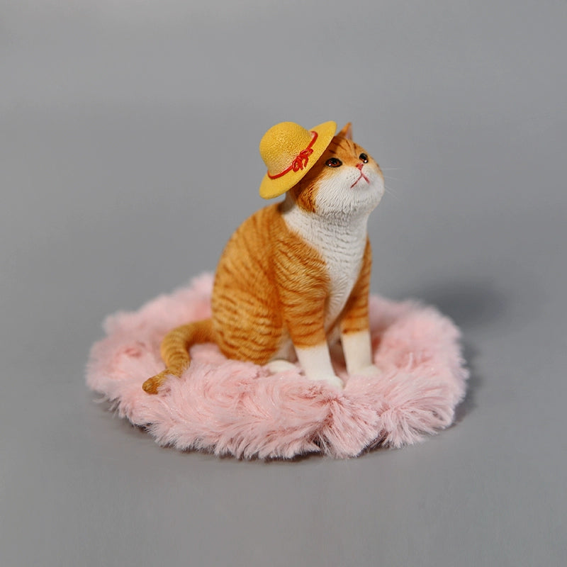 A collection of 1/6 scale Princess Cat Models featuring four distinct cat figurines. Each cat has a unique color and expression, with one cat wearing a yellow hat, sitting on a pink cushion, while others are arranged around a grey couch. The detailed design captures the cats' regal poses, making them a charming addition to any collection.