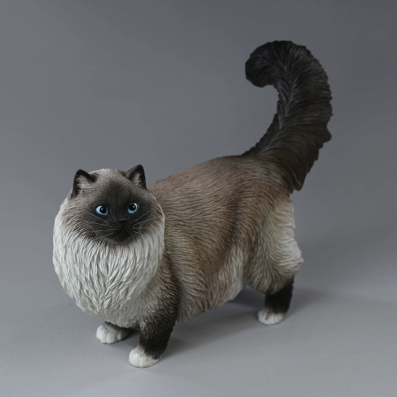 A group of four beautifully crafted Ragdoll cat resin models in various realistic poses and coat colors. The models are shown interacting with a person, highlighting their lifelike details and expressive faces.