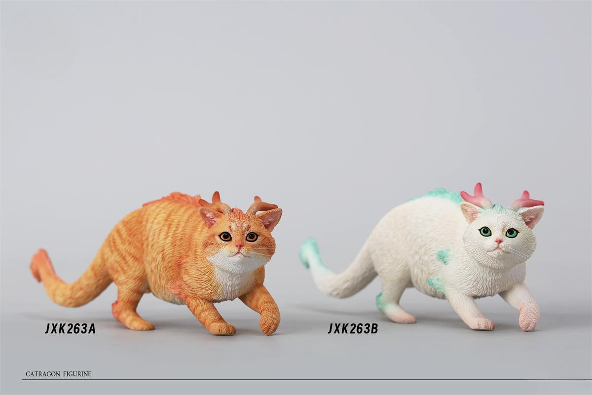 A highly detailed Catragon Figurine featuring a white feline with dragon-like features, including pastel green fur accents and delicate horns. This resin-crafted fantasy cat-dragon hybrid is an artistic and whimsical collectible. Ideal for display or as a gift for cat lovers and fantasy enthusiasts.