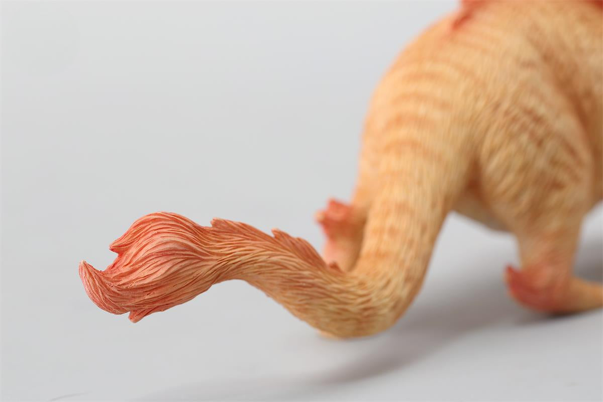 A highly detailed Catragon Figurine featuring a white feline with dragon-like features, including pastel green fur accents and delicate horns. This resin-crafted fantasy cat-dragon hybrid is an artistic and whimsical collectible. Ideal for display or as a gift for cat lovers and fantasy enthusiasts.