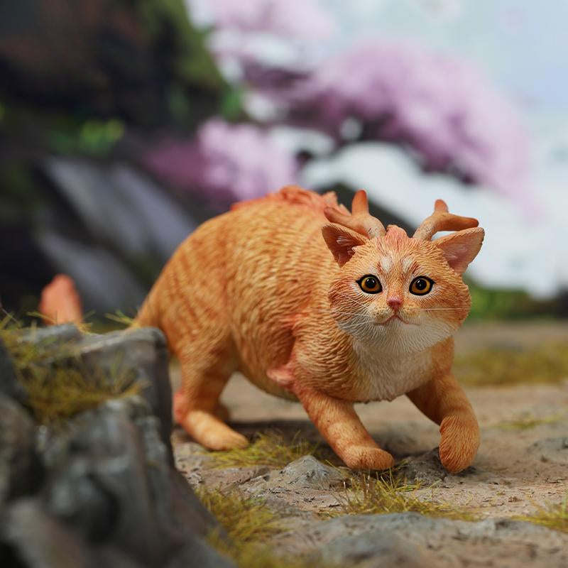 A highly detailed Catragon Figurine featuring a white feline with dragon-like features, including pastel green fur accents and delicate horns. This resin-crafted fantasy cat-dragon hybrid is an artistic and whimsical collectible. Ideal for display or as a gift for cat lovers and fantasy enthusiasts.