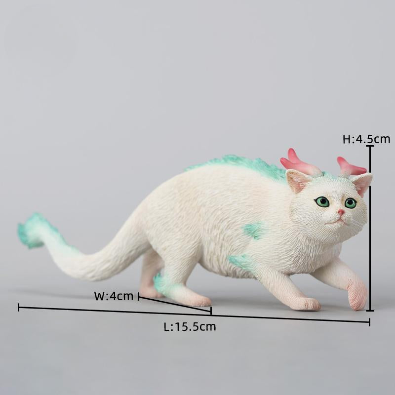 A highly detailed Catragon Figurine featuring a white feline with dragon-like features, including pastel green fur accents and delicate horns. This resin-crafted fantasy cat-dragon hybrid is an artistic and whimsical collectible. Ideal for display or as a gift for cat lovers and fantasy enthusiasts.