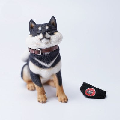 A collection of six Shiba Inu dog models in various poses, each wearing a black bandana with a red symbol. The detailed craftsmanship captures the playful and rebellious expressions of the dogs, set against a white background.