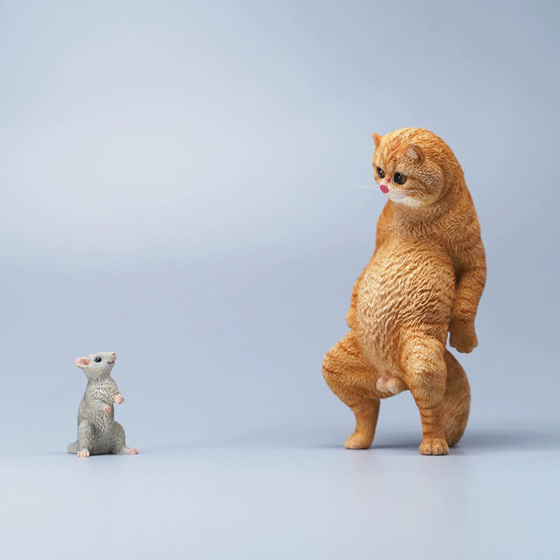 A set of six playful cat figurines featuring a humorous twist with paper bags over their heads. Each figurine showcases a distinct breed and color, from orange to black and white. The cats stand upright with exaggerated expressions, adding a touch of whimsy to any collection.