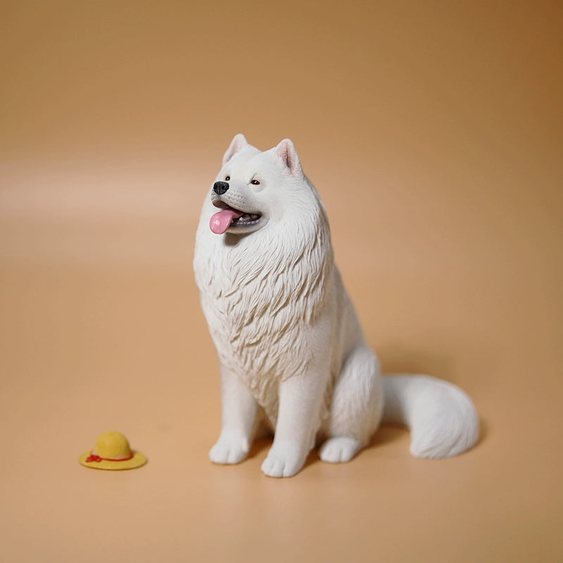 "Two 1/6 scale Samoyed dog models, one standing and the other sitting with a yellow hat, both showcasing their fluffy white coats and joyful expressions, set against a warm beige background."