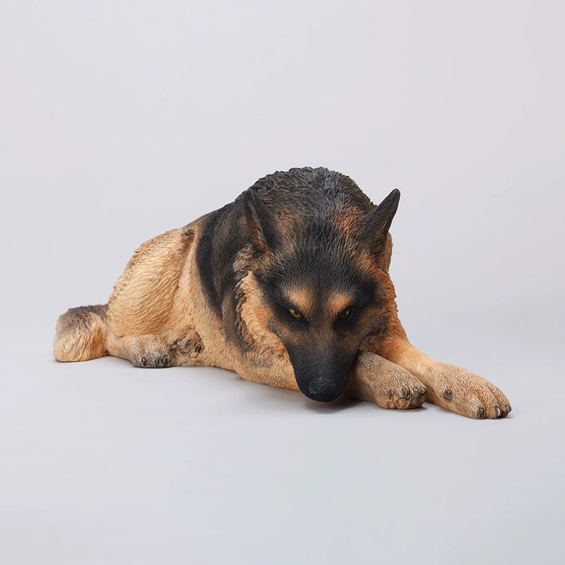 A 1/6 scale resin figurine of a lying German Shepherd dog, meticulously crafted with lifelike fur details, expressive eyes, and a realistic pose. Hand-painted to perfection, this dog statue is ideal for collectors and pet lovers, enhancing any space with its realistic appearance.