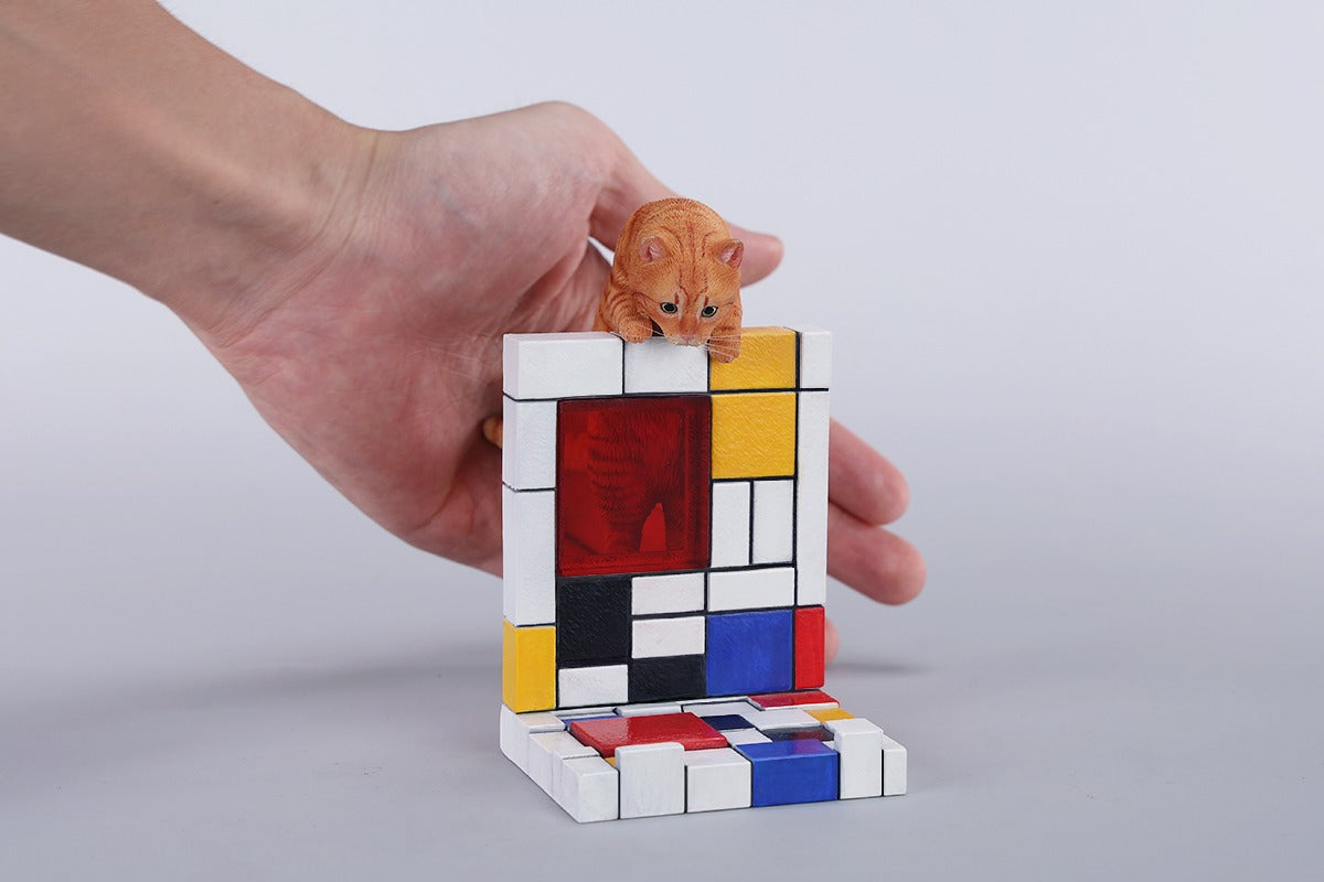 A 1/6 scale Mondrian wall-climbing cat figurine crafted from high-quality resin, featuring a playful cat climbing a colorful cubist-style wall, offering a unique and stylish addition to any home decor.