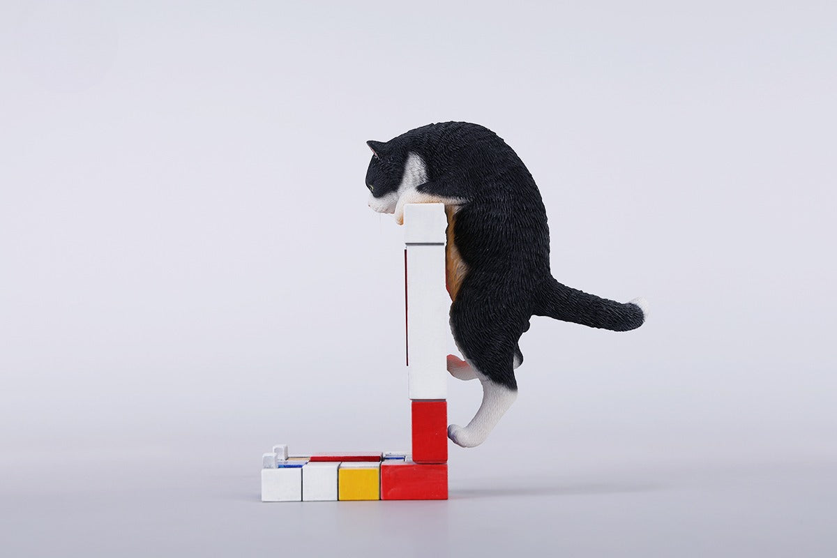 A 1/6 scale Mondrian wall-climbing cat figurine crafted from high-quality resin, featuring a playful cat climbing a colorful cubist-style wall, offering a unique and stylish addition to any home decor.