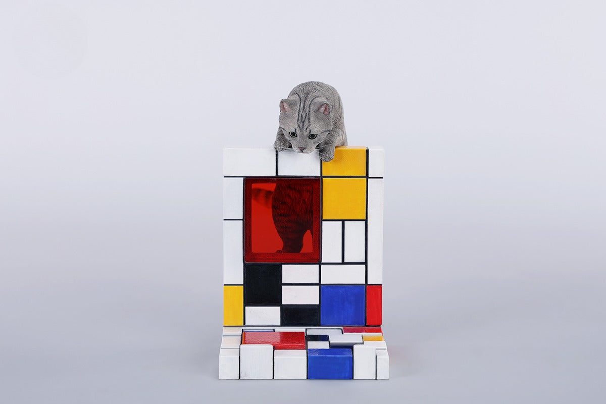 A 1/6 scale Mondrian wall-climbing cat figurine crafted from high-quality resin, featuring a playful cat climbing a colorful cubist-style wall, offering a unique and stylish addition to any home decor.