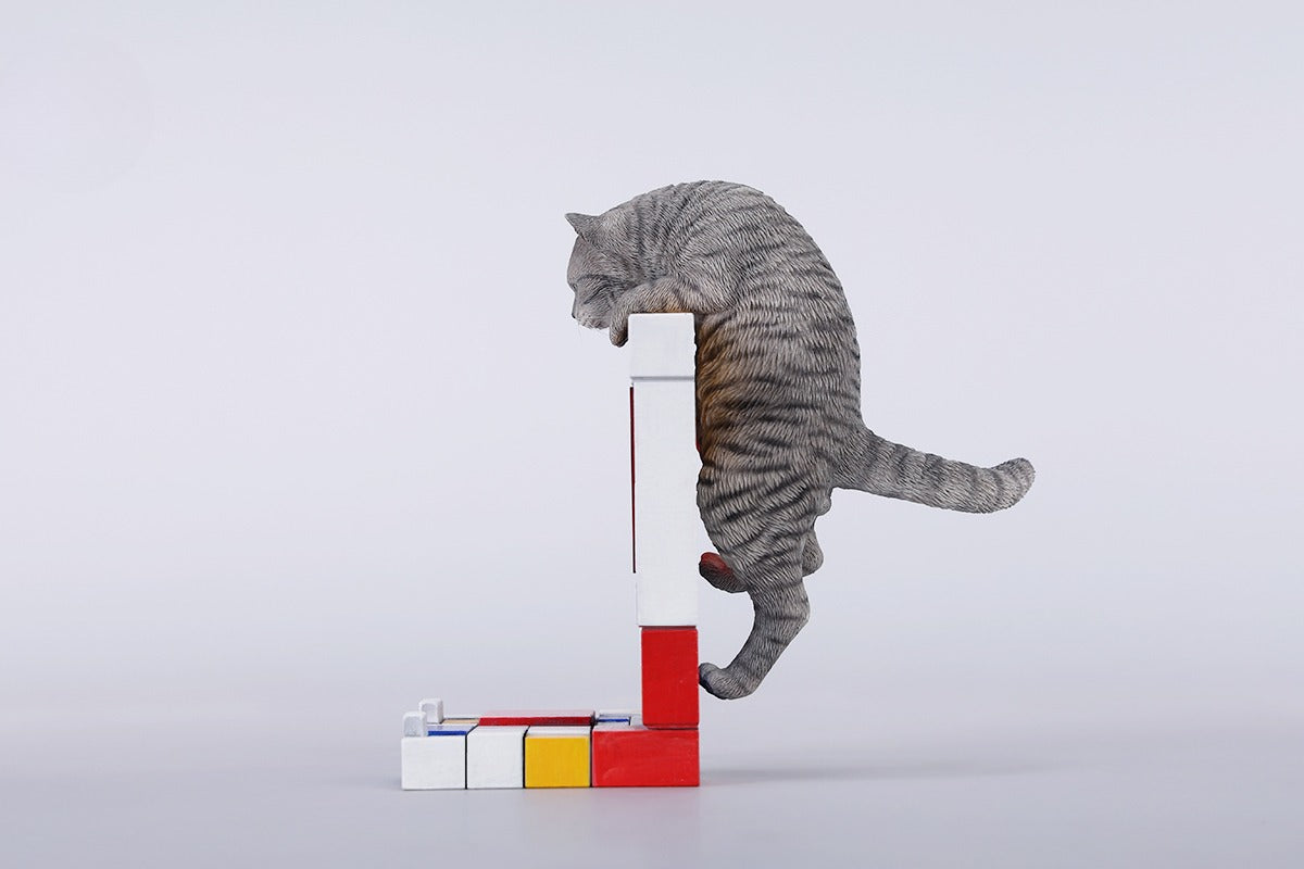 A 1/6 scale Mondrian wall-climbing cat figurine crafted from high-quality resin, featuring a playful cat climbing a colorful cubist-style wall, offering a unique and stylish addition to any home decor.