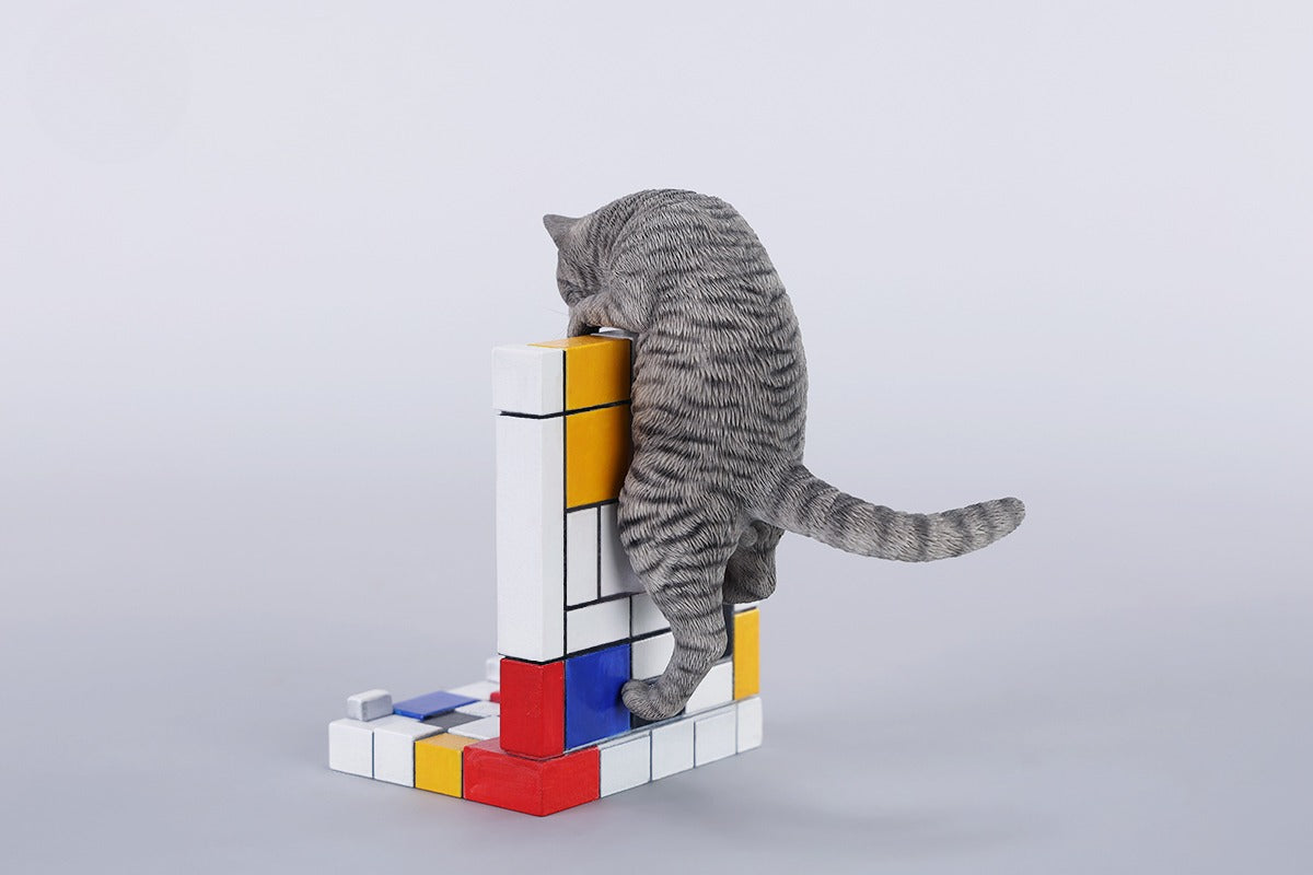 A 1/6 scale Mondrian wall-climbing cat figurine crafted from high-quality resin, featuring a playful cat climbing a colorful cubist-style wall, offering a unique and stylish addition to any home decor.