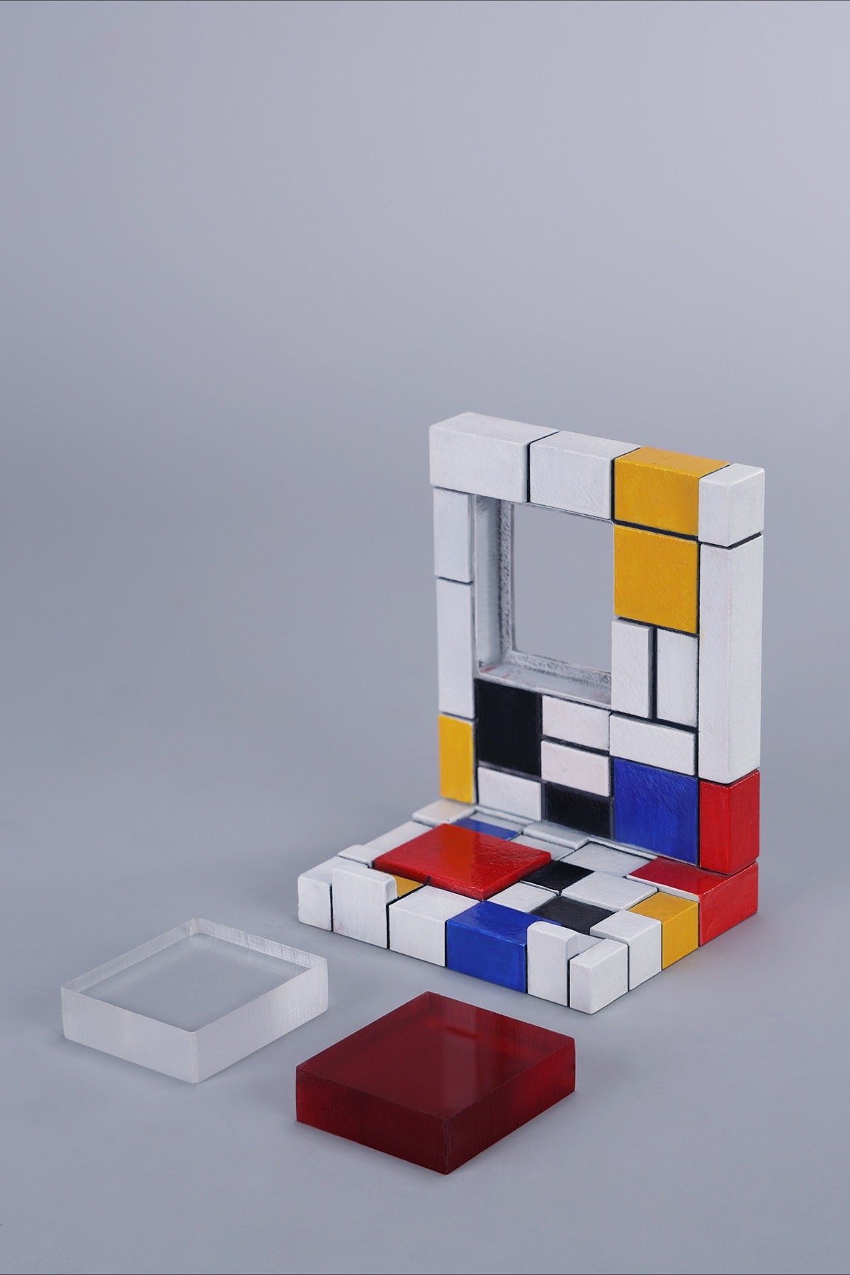 A 1/6 scale Mondrian wall-climbing cat figurine crafted from high-quality resin, featuring a playful cat climbing a colorful cubist-style wall, offering a unique and stylish addition to any home decor.