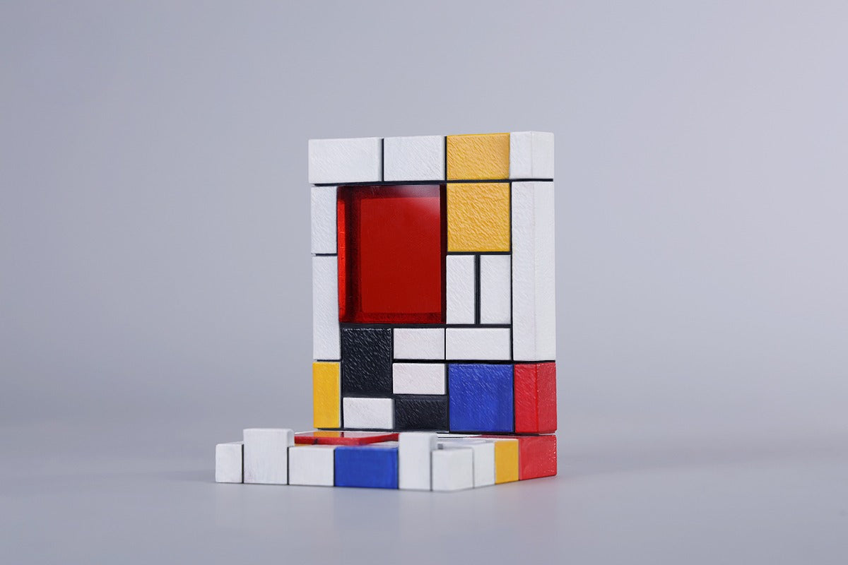 A 1/6 scale Mondrian wall-climbing cat figurine crafted from high-quality resin, featuring a playful cat climbing a colorful cubist-style wall, offering a unique and stylish addition to any home decor.