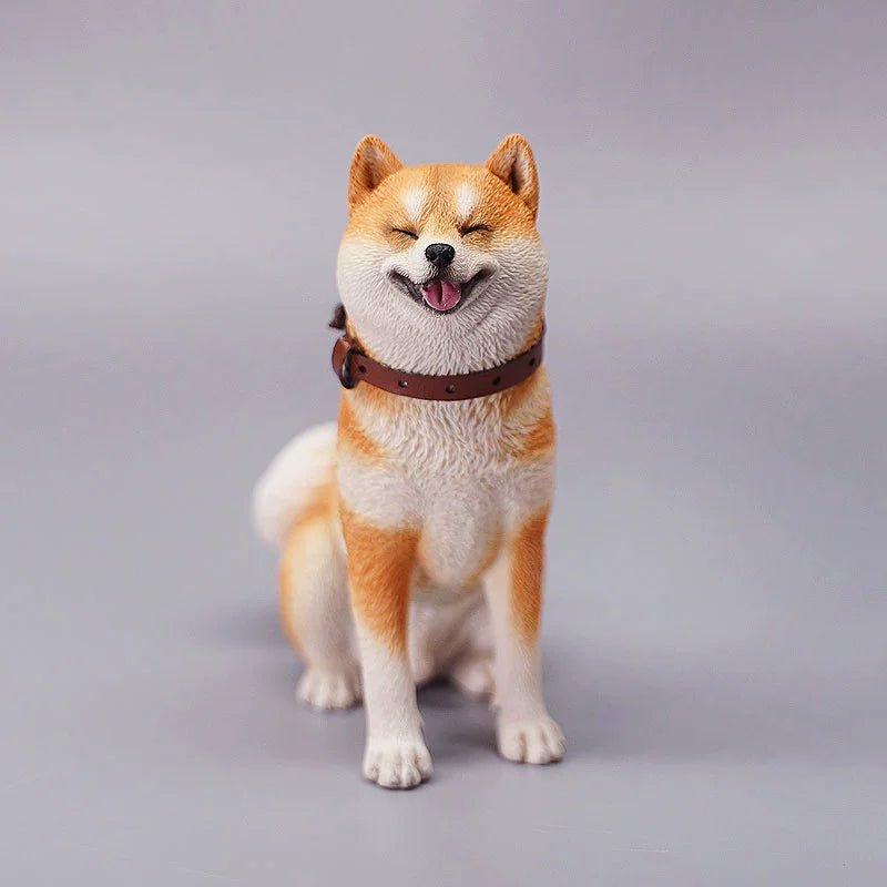 "Three realistic 1/6 scale Shiba Inu dog figurines in a sitting position, showcasing their adorable airplane ear feature. The figurines display three different coat colors: black and tan, red and white, and pure white. Each figurine is intricately detailed with a leather collar, capturing the breed's characteristic cheerful expression."