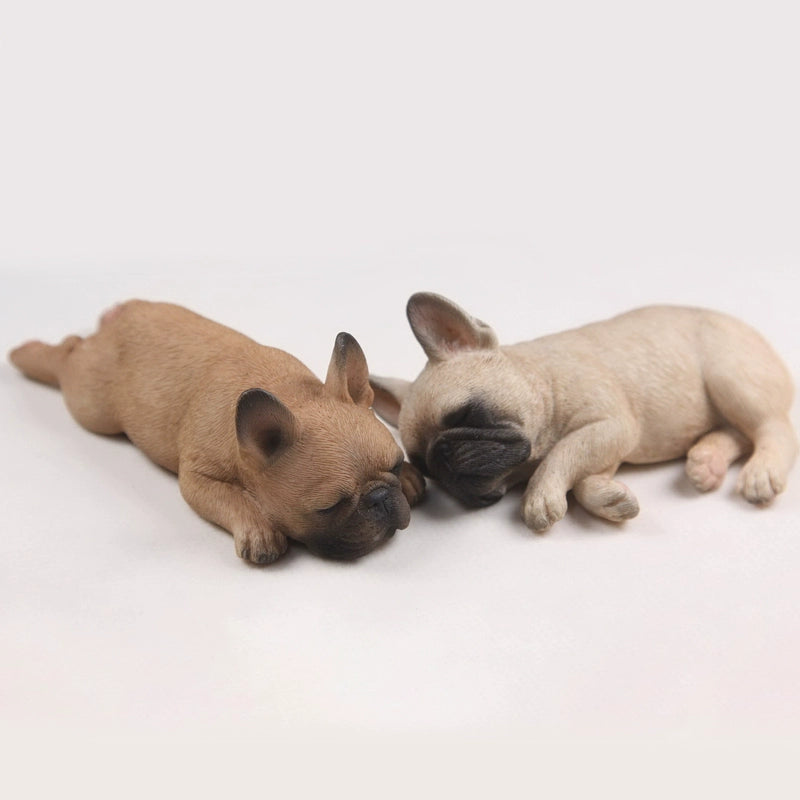 This image features a pair of intricately detailed 1/6 scale French Bulldog models in a sleeping position. The lifelike design captures the essence of these adorable dogs, making them perfect for collectors and dog enthusiasts. Each model showcases a different color variation, adding variety to your collection.